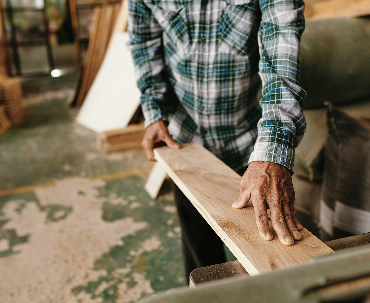 Craftsperson working with wood in workshop