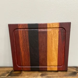 Multi-colored striped wooden cutting board